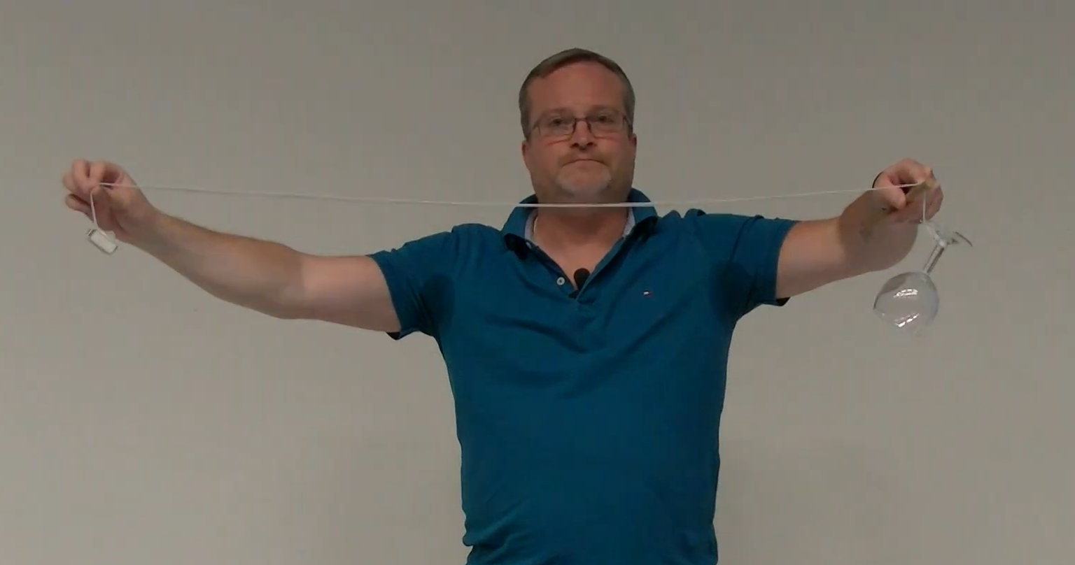 Ron demonstrating conservation of angular momentum.