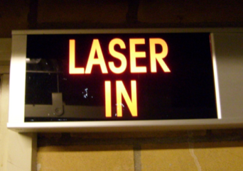 Warning lights above the doors indicate whether the laser in the room is in use.